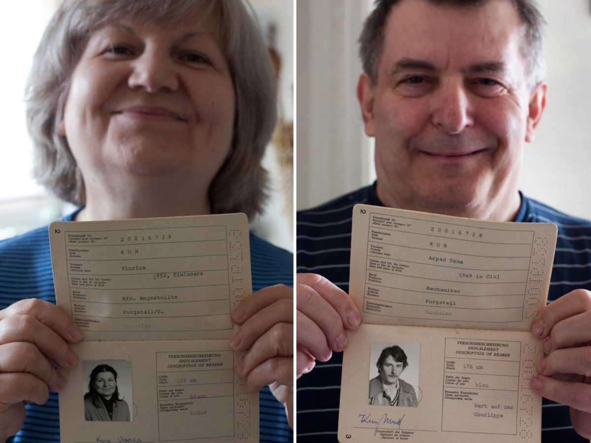 mom and dad in 2011, close ups holding their refugee passports from Austria in 1981